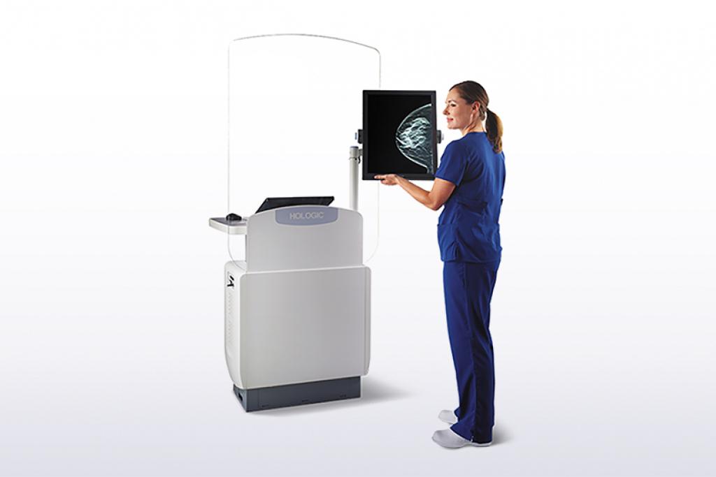 Technician using medical equipment on white background.